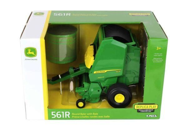 Presse à balles rondes JOHN DEERE 561R avec balle